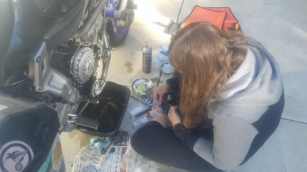 working on repairing a motorcycle