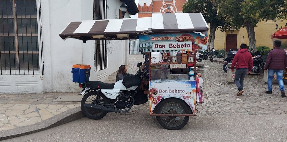 motorcycle-powered food cart on the street