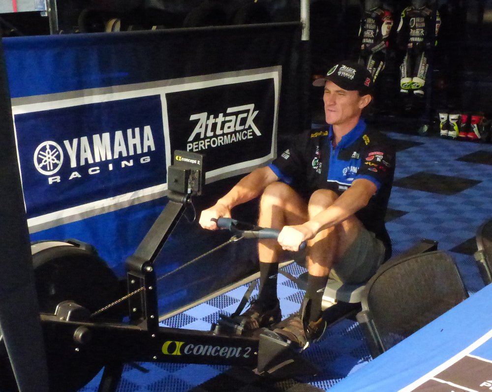 Gagne exercising on a rowing machine in the race paddock