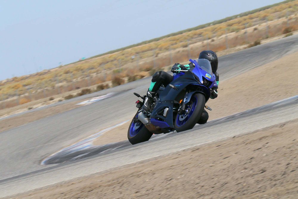 2022 Yamaha R7 leaning left through a corner on a racetrack