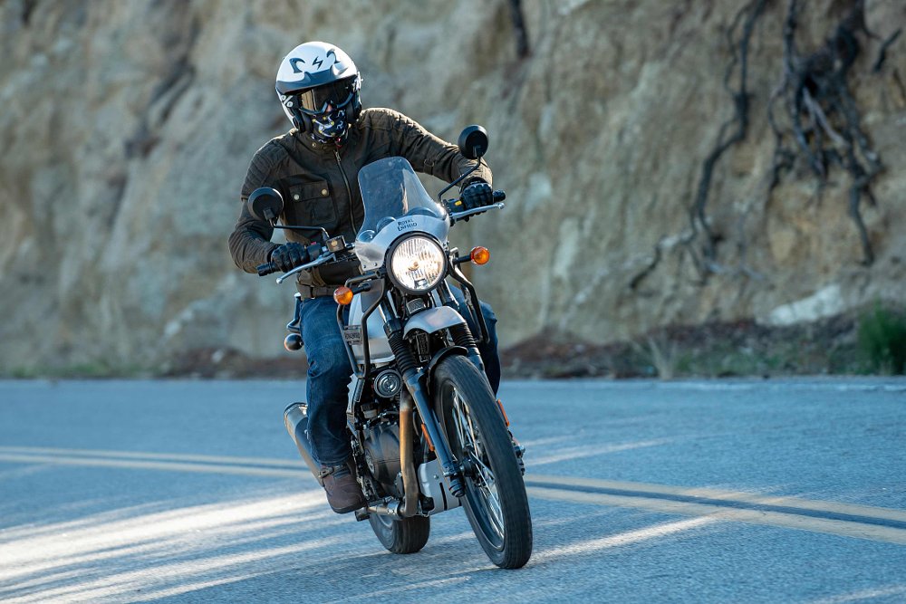 2022 Royal Enfield Himalayan riding at the camera down a paved road