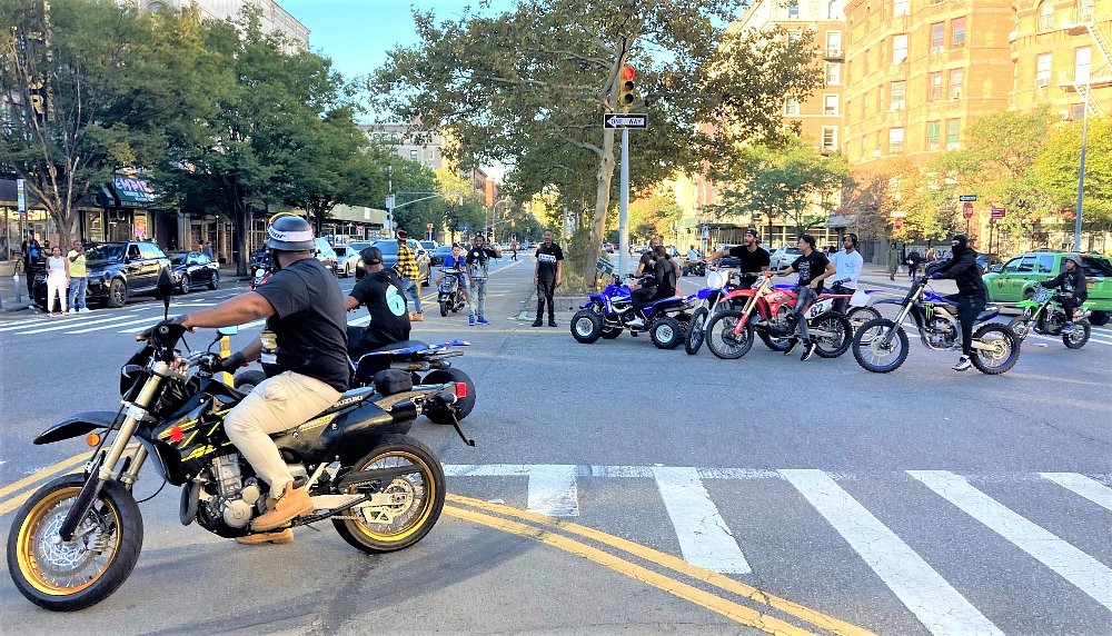 riders take over a city street