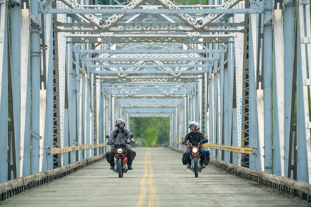 Honda Trail 125 and CT90 on a bridge in Alaska.