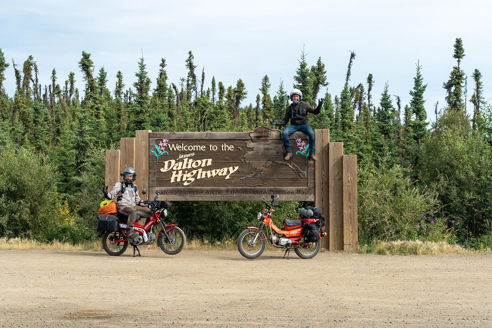 CTXP at the Dalton Highway sign with the Trail 125 and CT90.