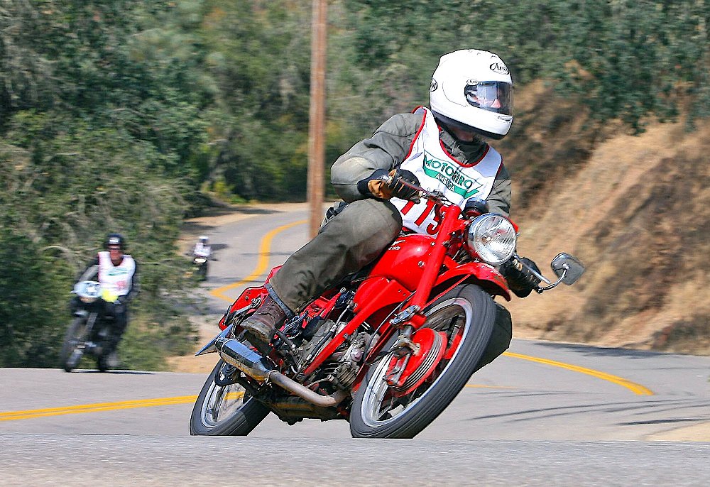 Dave Roper riding his vintage motorcycle on the road
