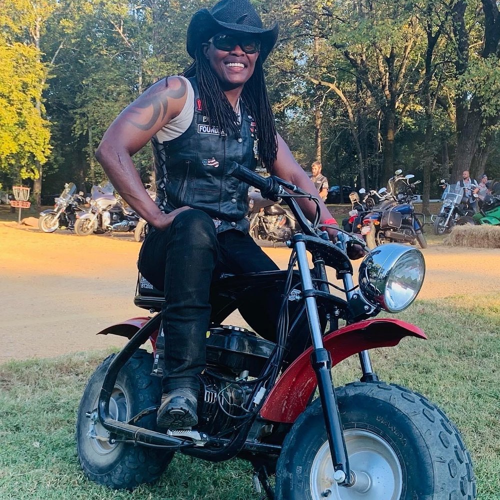 Kimba on a minibike at the K River Campground