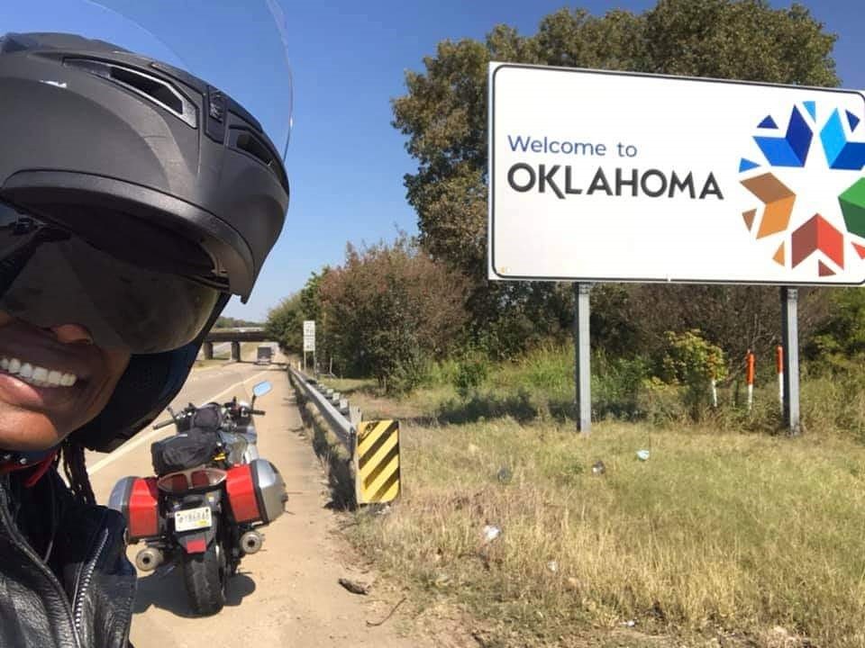 selfie at the Oklahoma state line sign
