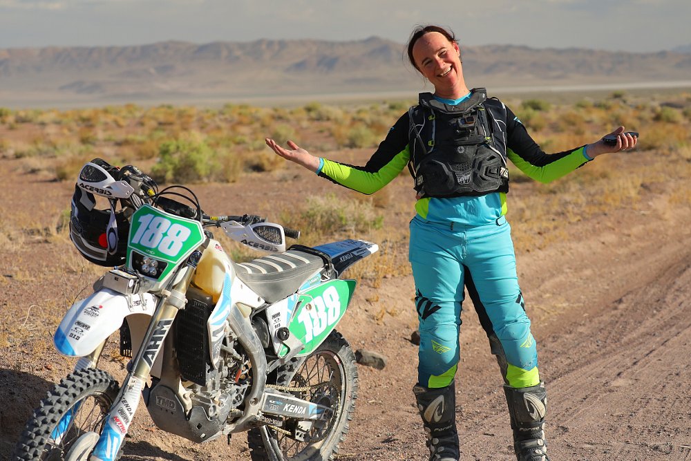 Allison standing by her broken-down motorcycle