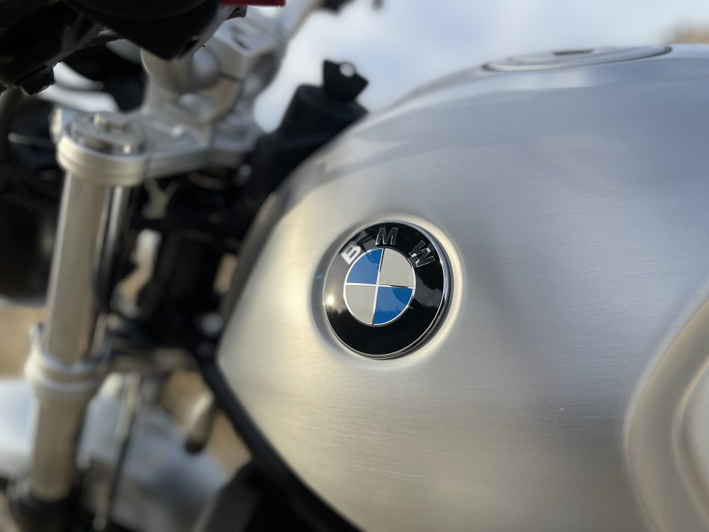 A close up of the BMW logo badge on the motorcycle tank