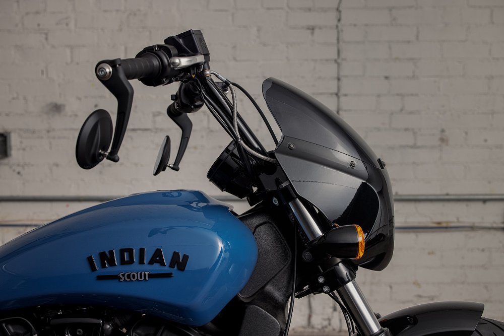 Indian Scout Rogue black fairing on blue motorcycle