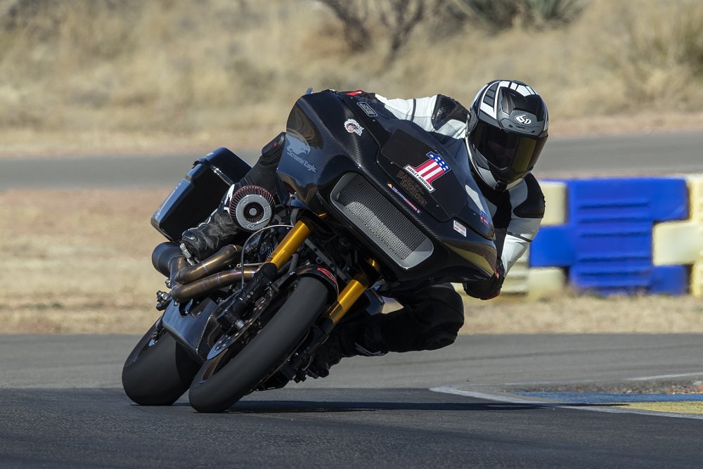 2021 Harley-Davidson King of the Baggers Road Glide Special race bike riding at camera on a race track