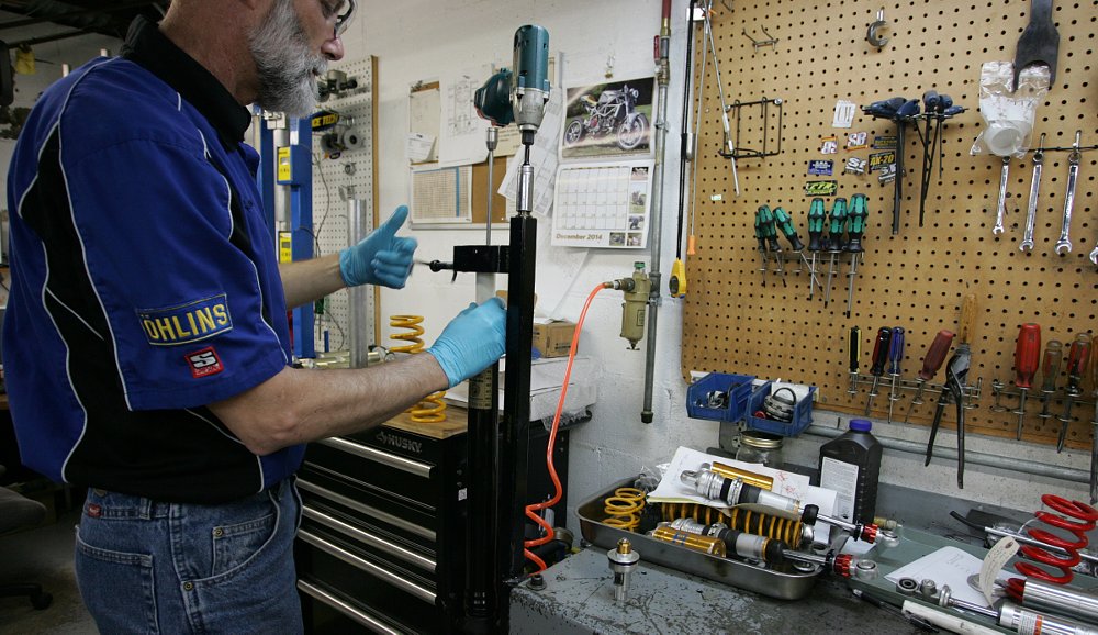 working on the Yamaha YZF-R6's suspension in the shop