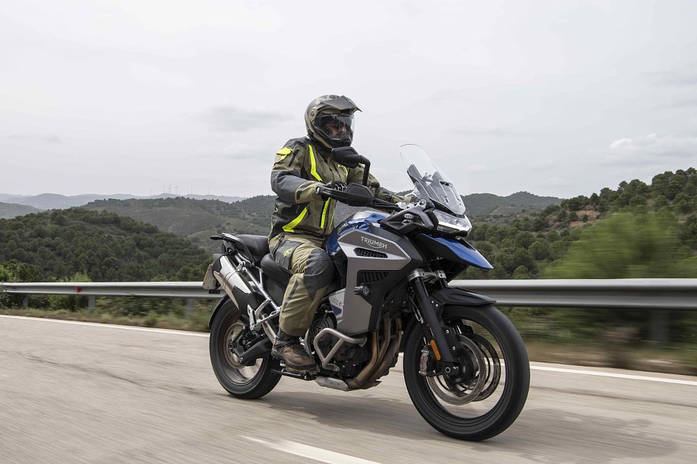 Triumph Tiger 1200 GT Explorer tracking along a paved road