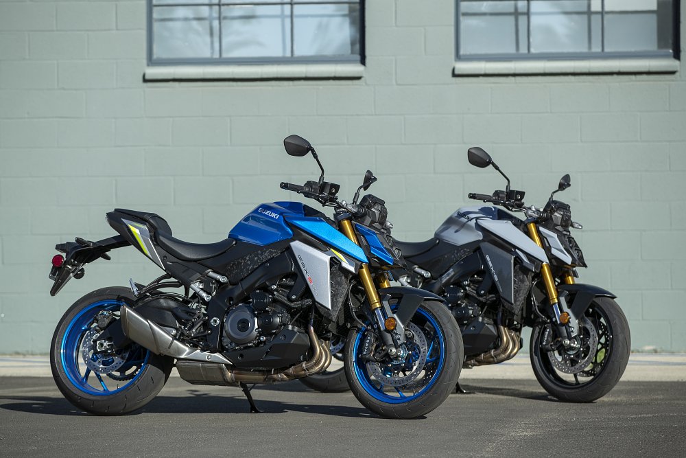 Suzuki GSX-S1000 naked bike in both blue and gray colors parked in a parking lot
