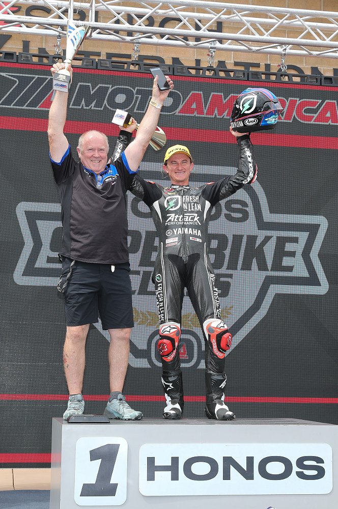 Jake Gagne on the podium for a race win with crew chief Jon Cornwell