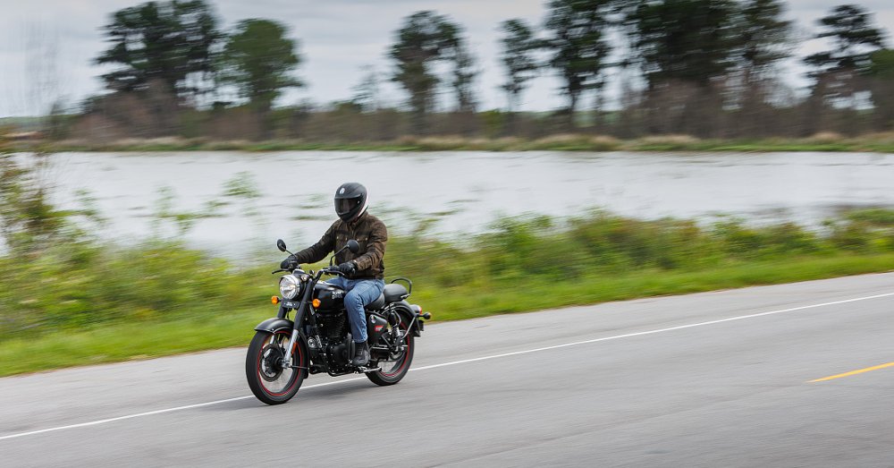 Classic 350 on a country road along the water