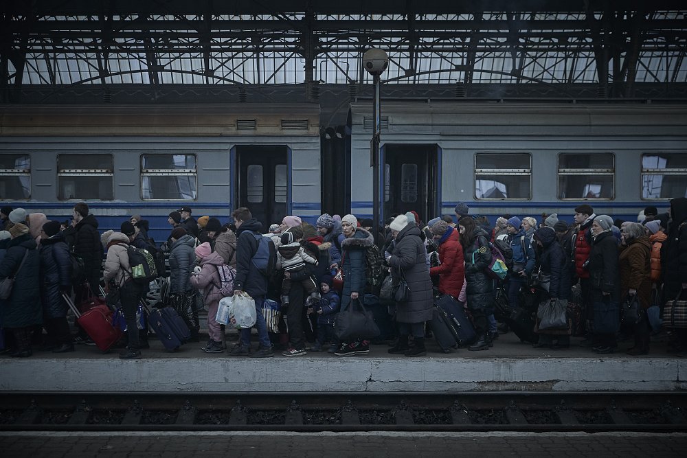 line of refugees waiting for a train in Ukraine