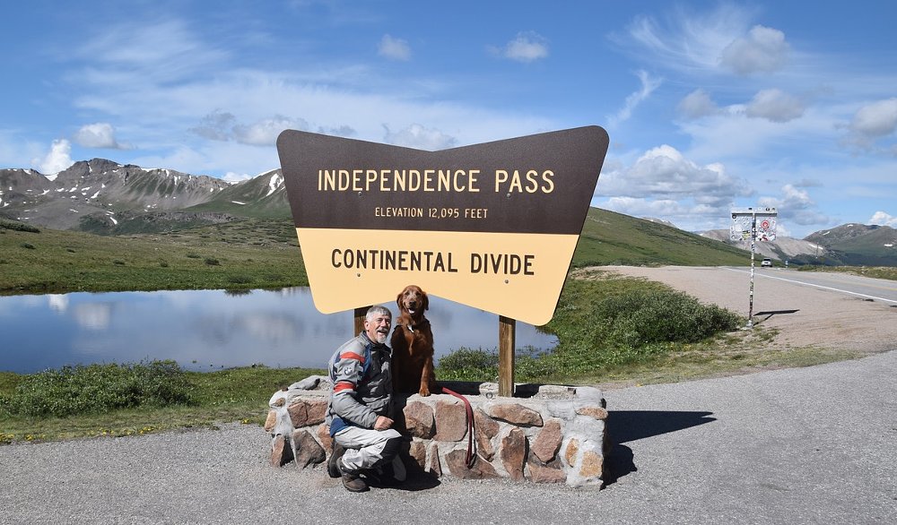 man and dog at the top of Independence Pass