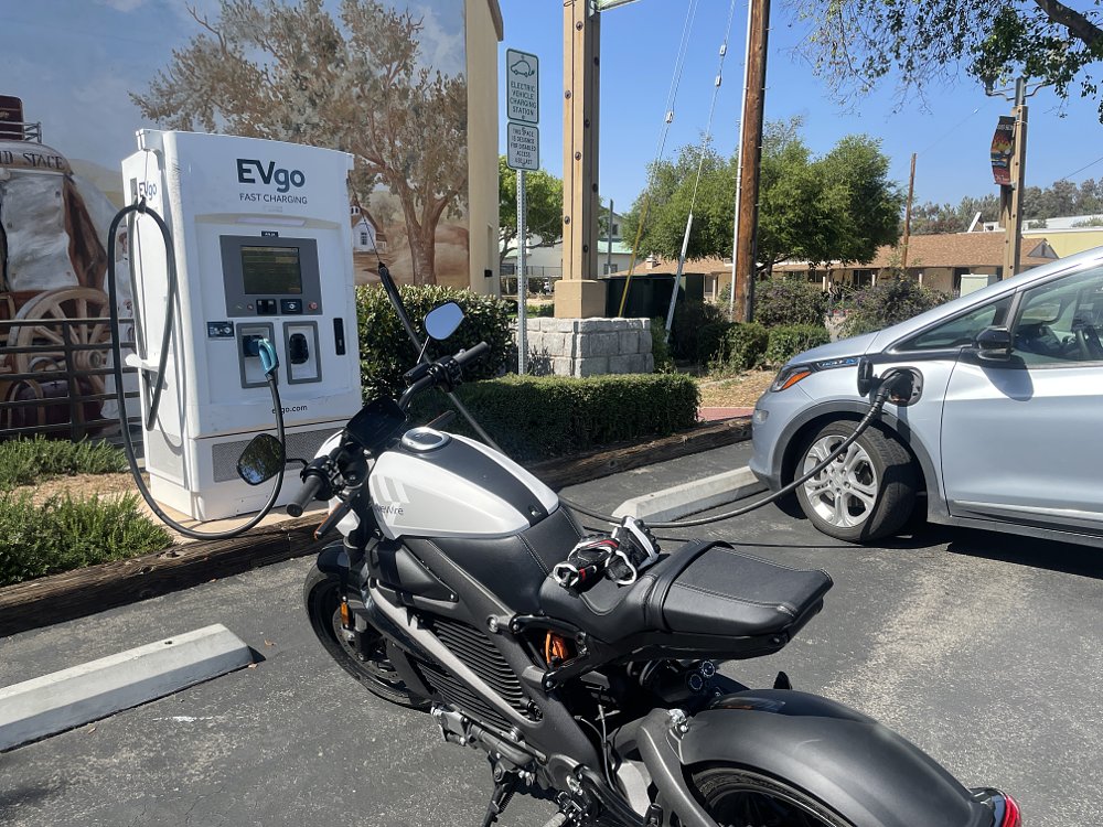 The LiveWire ONE electric motorcycle waiting to be plugged into a fast charger