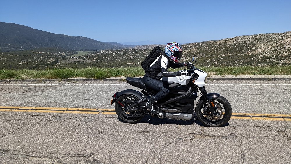 A photo of female rider on board the Livewire ONE on a back country road