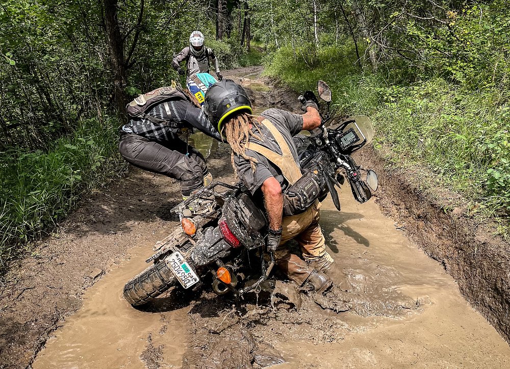 lifting a motorcycle out of a mud hole