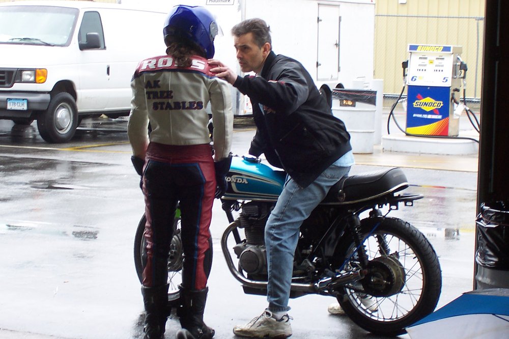 Jen gets some words of advice from her father as she is about to go onto the track