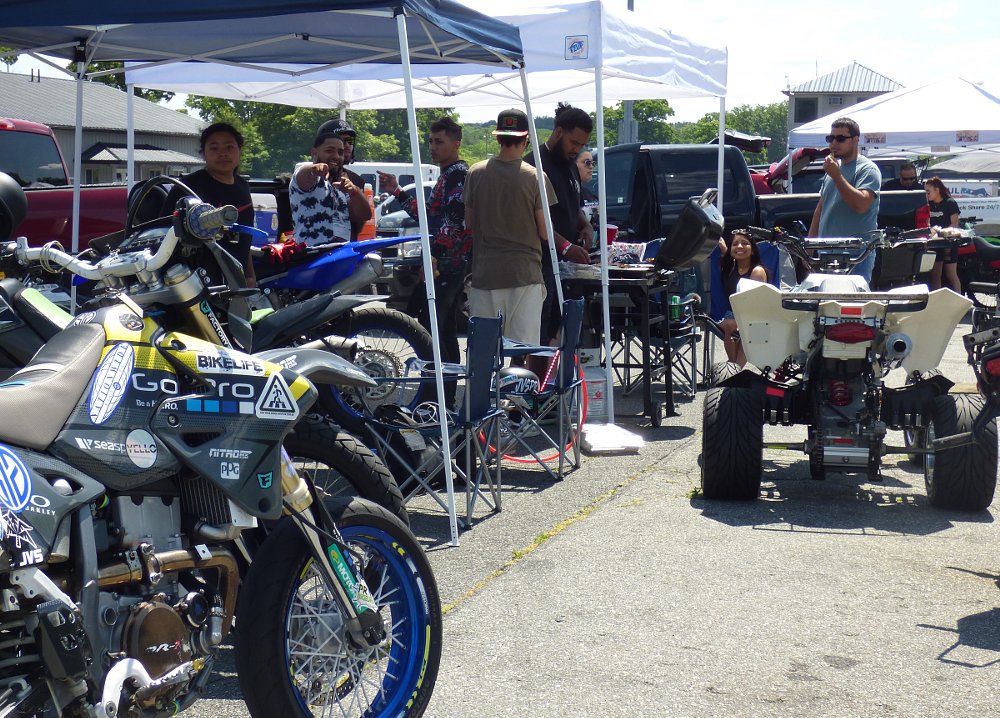 young adults hanging out in the race track paddock
