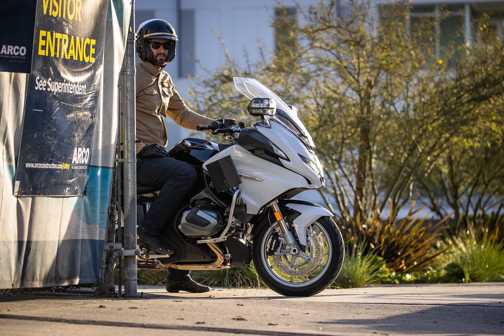 2022 BMW R 1250 RT-Police parked and waiting behind a chainlink fence.