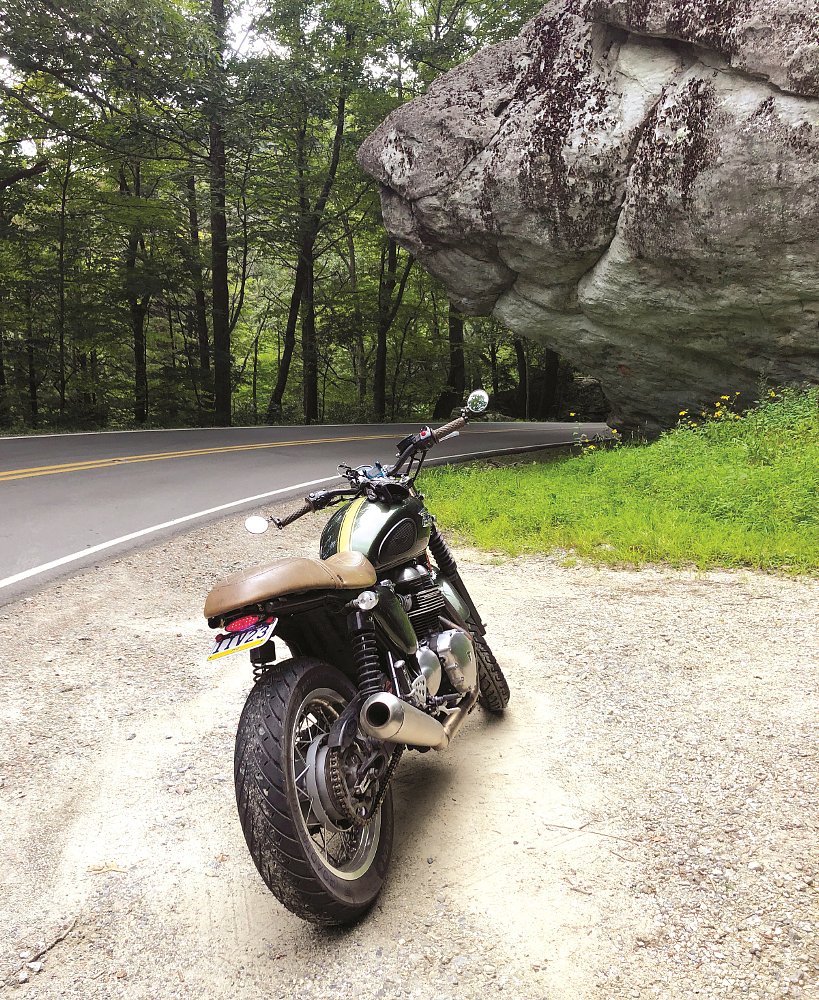 boulder overhanging the road
