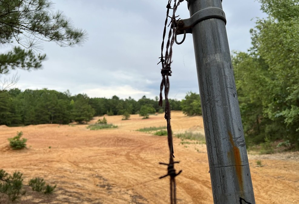 barbed wire in front of the empty lot where Blackwood used to be