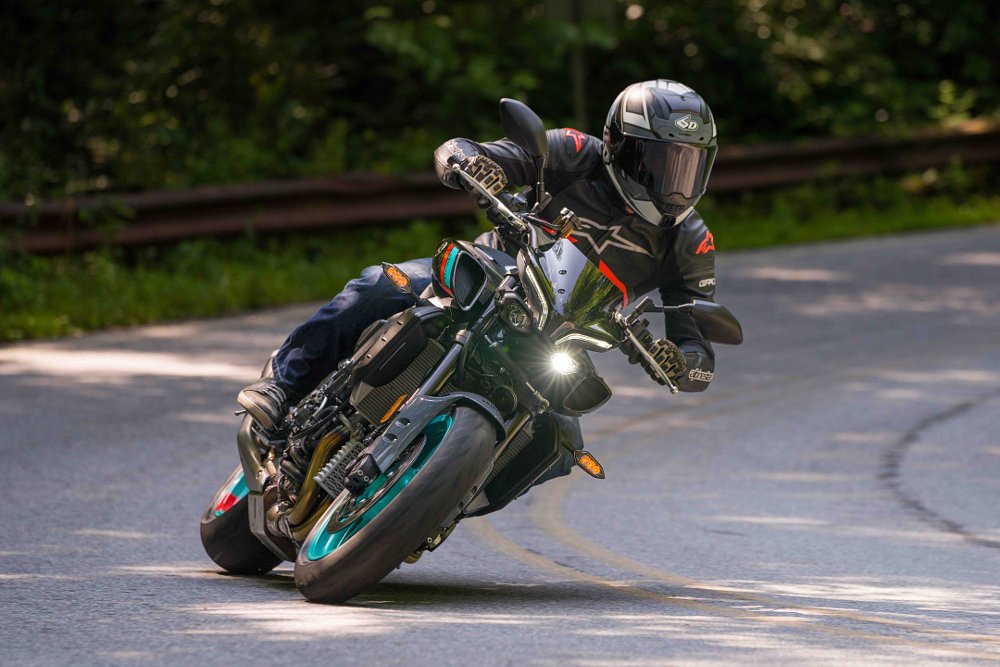 2022 Yamaha MT-10 leaned into a left turn from the front