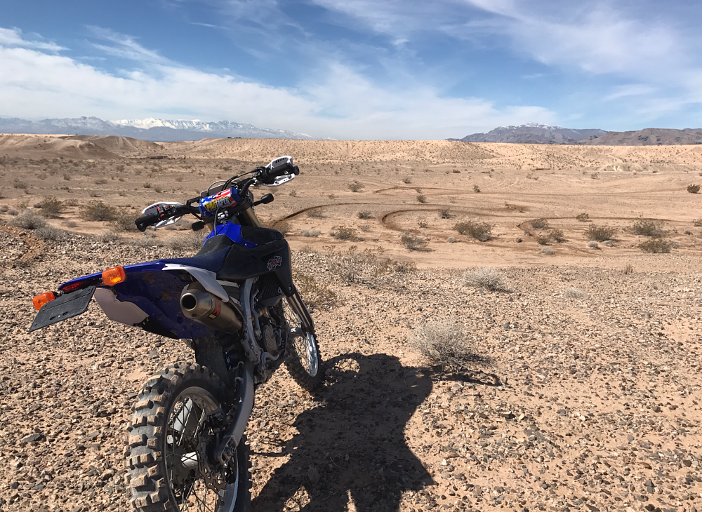 a long parked bike in a wide open desert vista view