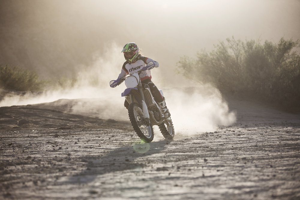 A solo rider is kicking up dust on their dirtbike in Ocotillo wells