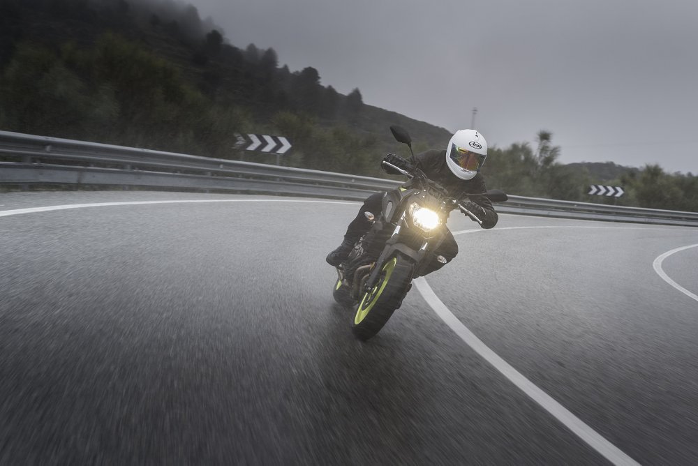 rider on the road in the rain