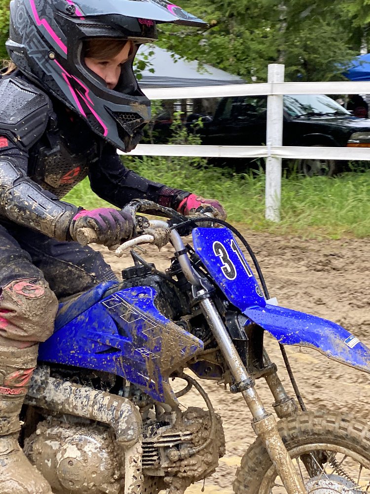 Gabbi's face showing determination as she races