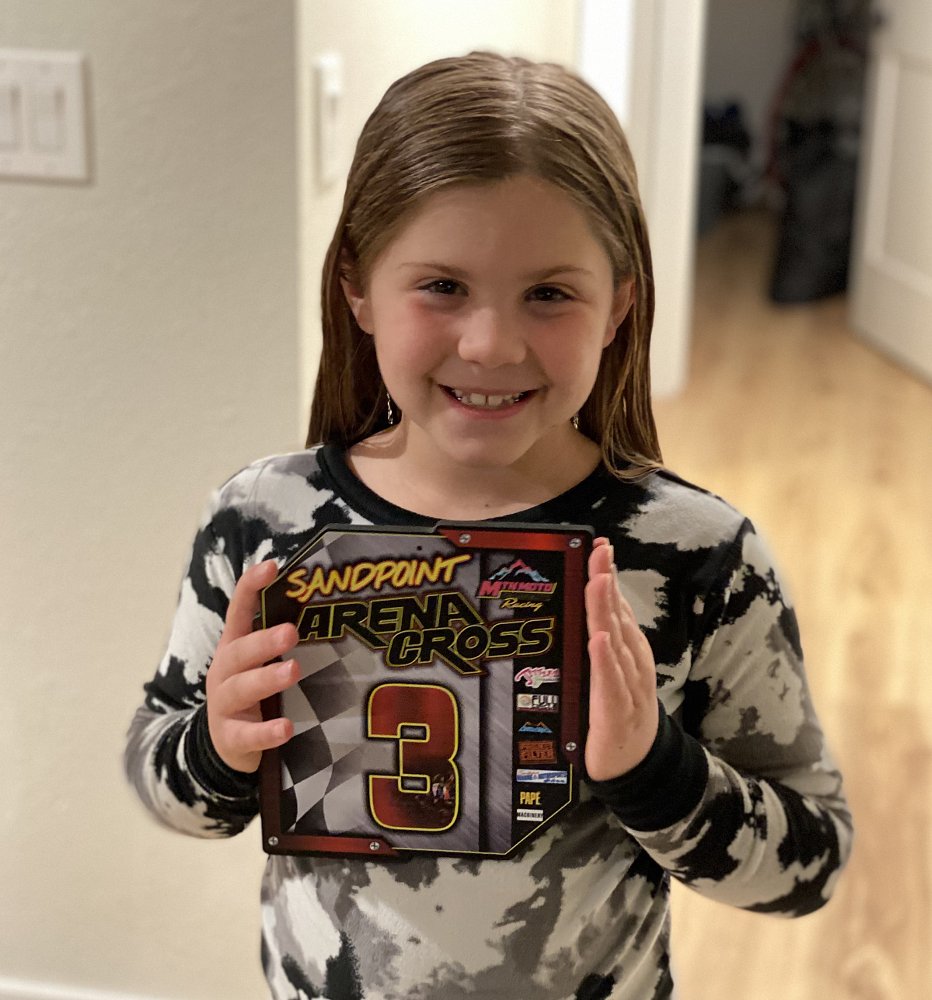 Gabbi smiling and holding her plaque