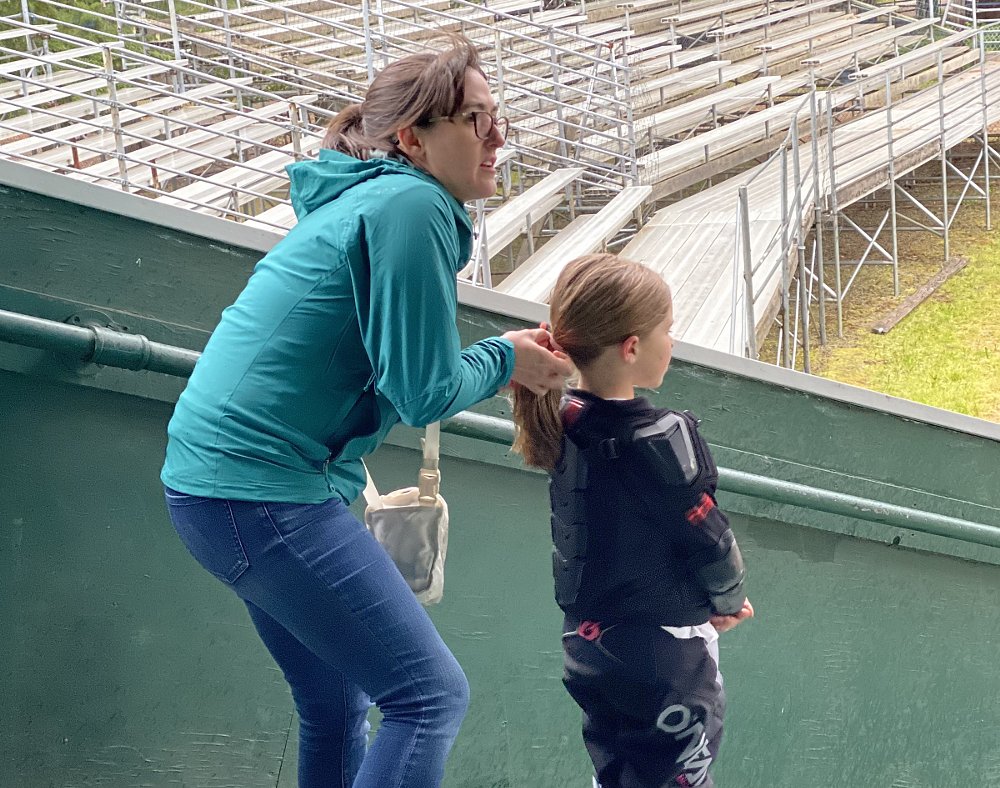 Aunt Andrea ties a ponytail for Gabbi before the race