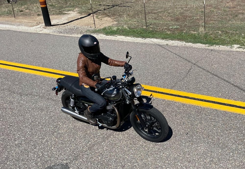 A top down view of a female rider on the Triumph Speed Twin 900 motorcycle