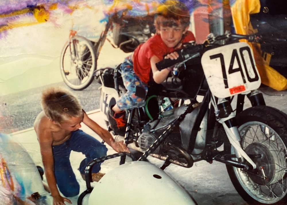 Ari and Zack as children in a vintage racing sidecar