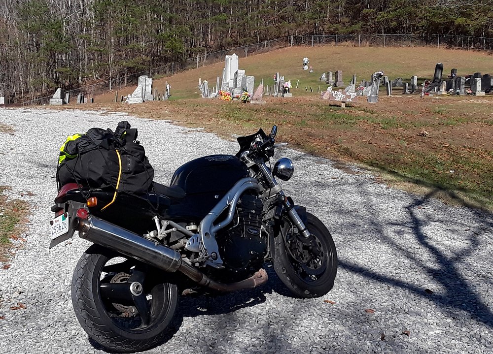 Speed Triple, loaded up, parked at a country cemetery