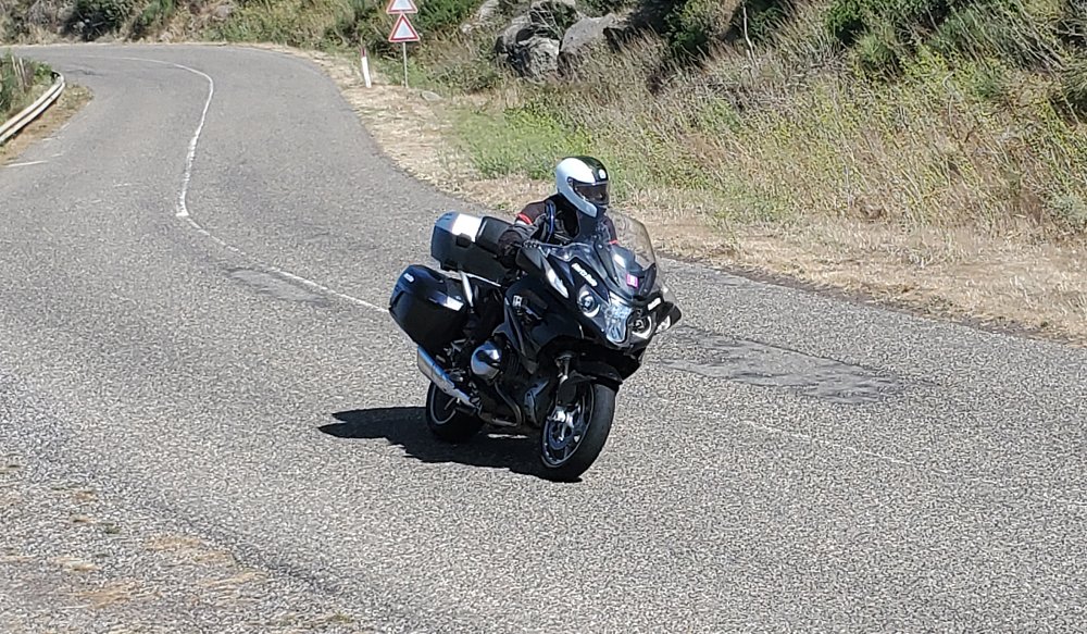 riding the BMW through the curves of a road in Sardinia