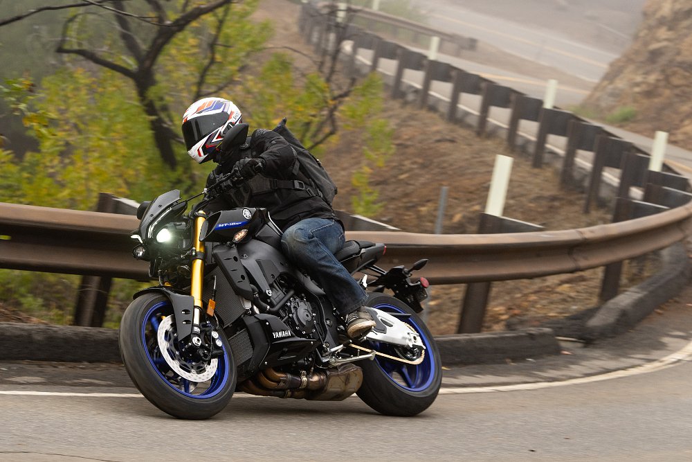 2022 Yamaha MT-10 SP riding along a twisty road.