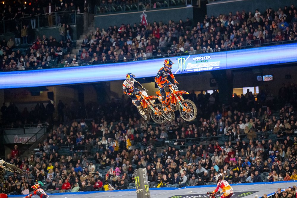racers flying over jumps at the opening round of Monster Energy AMA Supercross