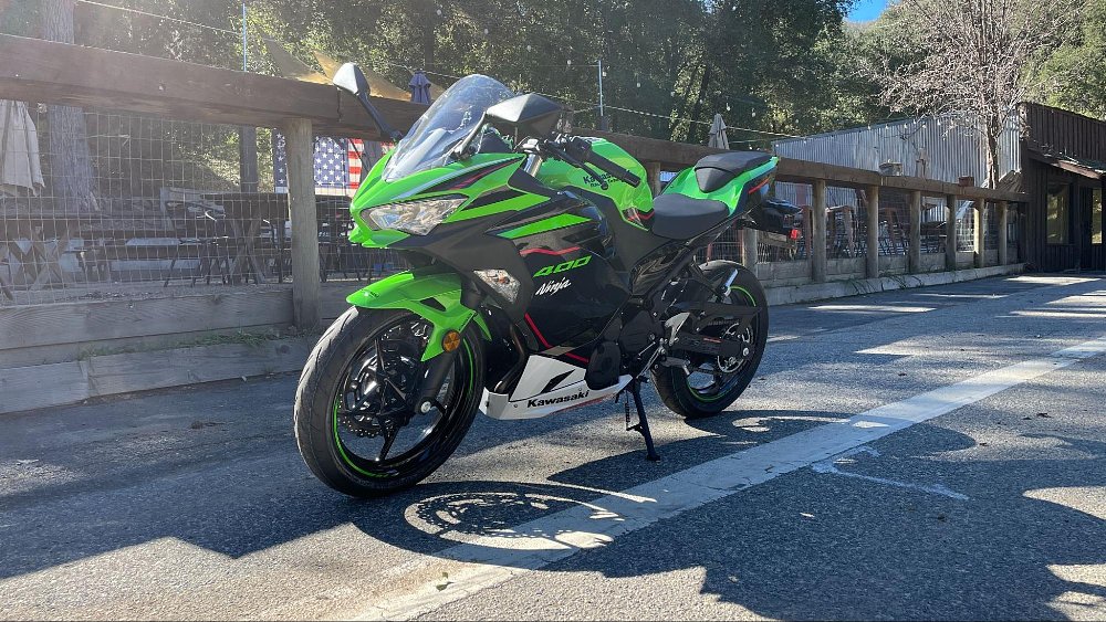 Photo of the Ninja 400 parked in front of a famous wooden saloon