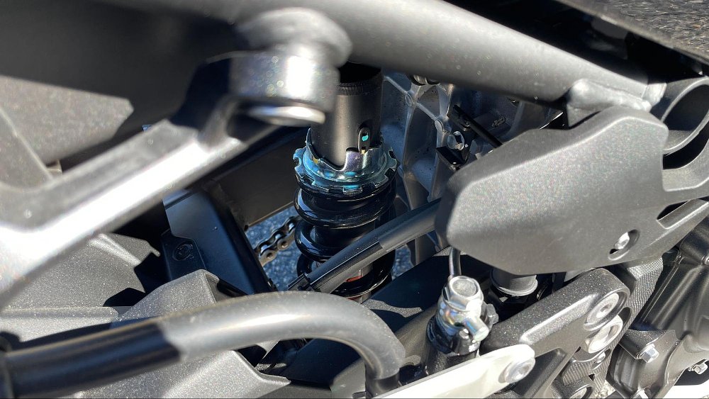 close up view of the rear shock suspension on the kawasaki ninja 400