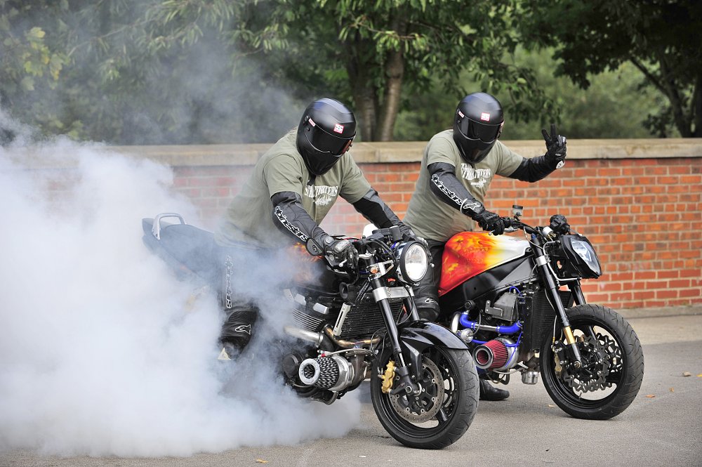two turbocharged motorcycles doing burnouts