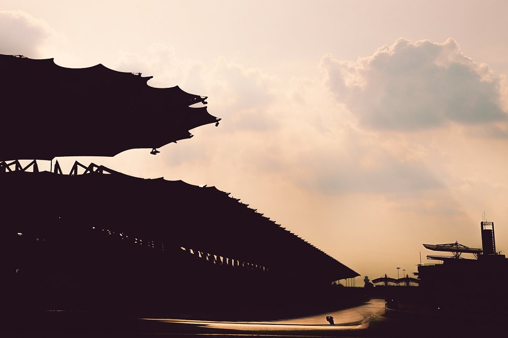Racer on the track at sunset
