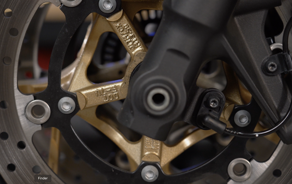 Motorcycle front wheel installed backwards.