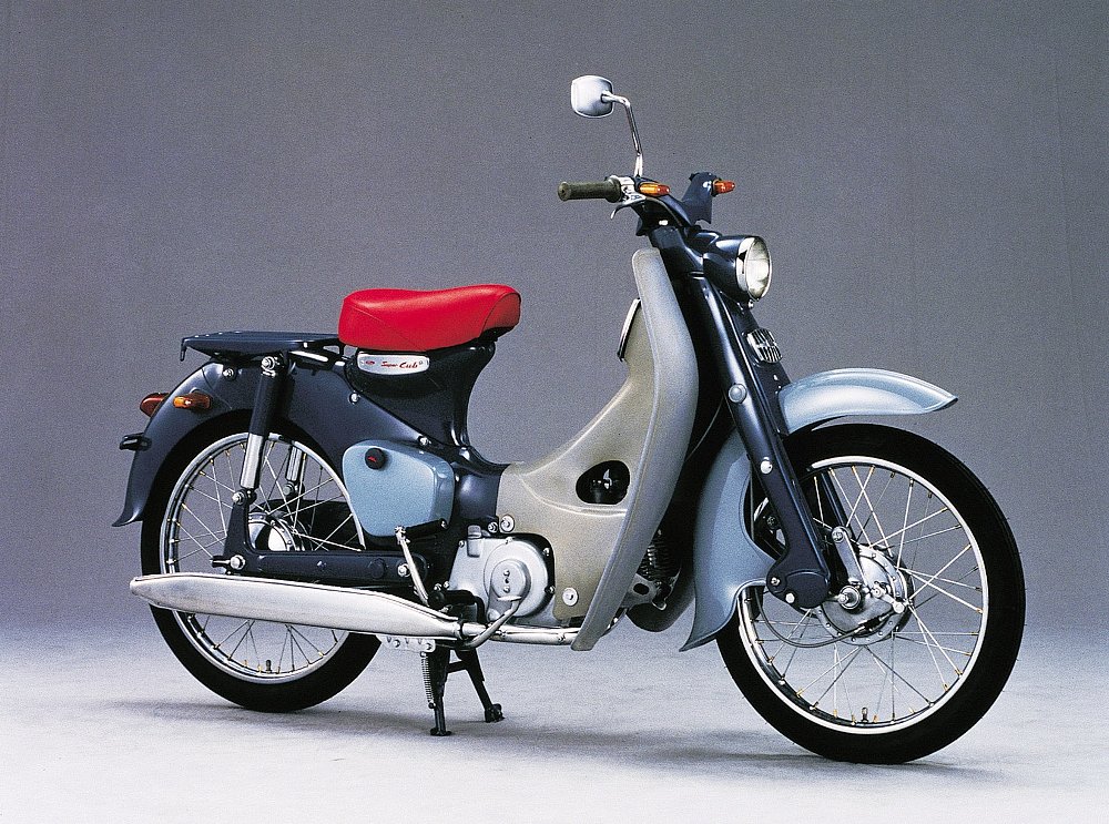 studio photo of a 1958 Honda Cub