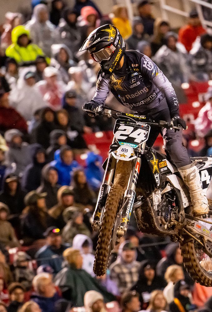 Racer RJ Hampshire flying over a jump in a Supercross race
